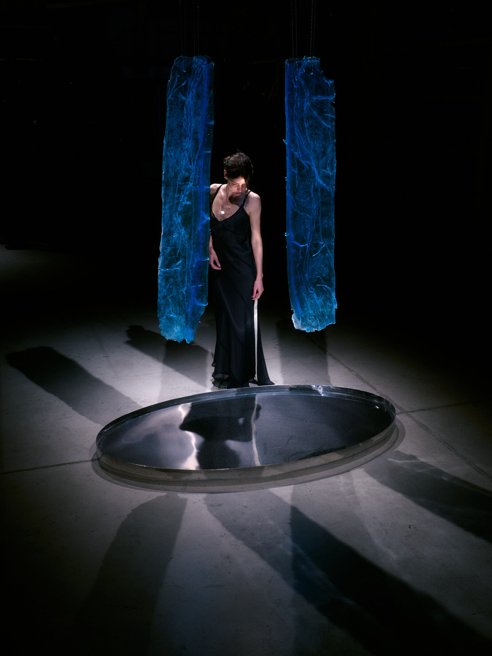 Levitating glass forms over water, Illusion installation